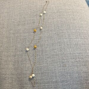 Elegant Gold and White Beaded Necklace